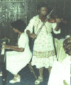 Lauren Williams playing violin with mother assistance from mother Sylnice